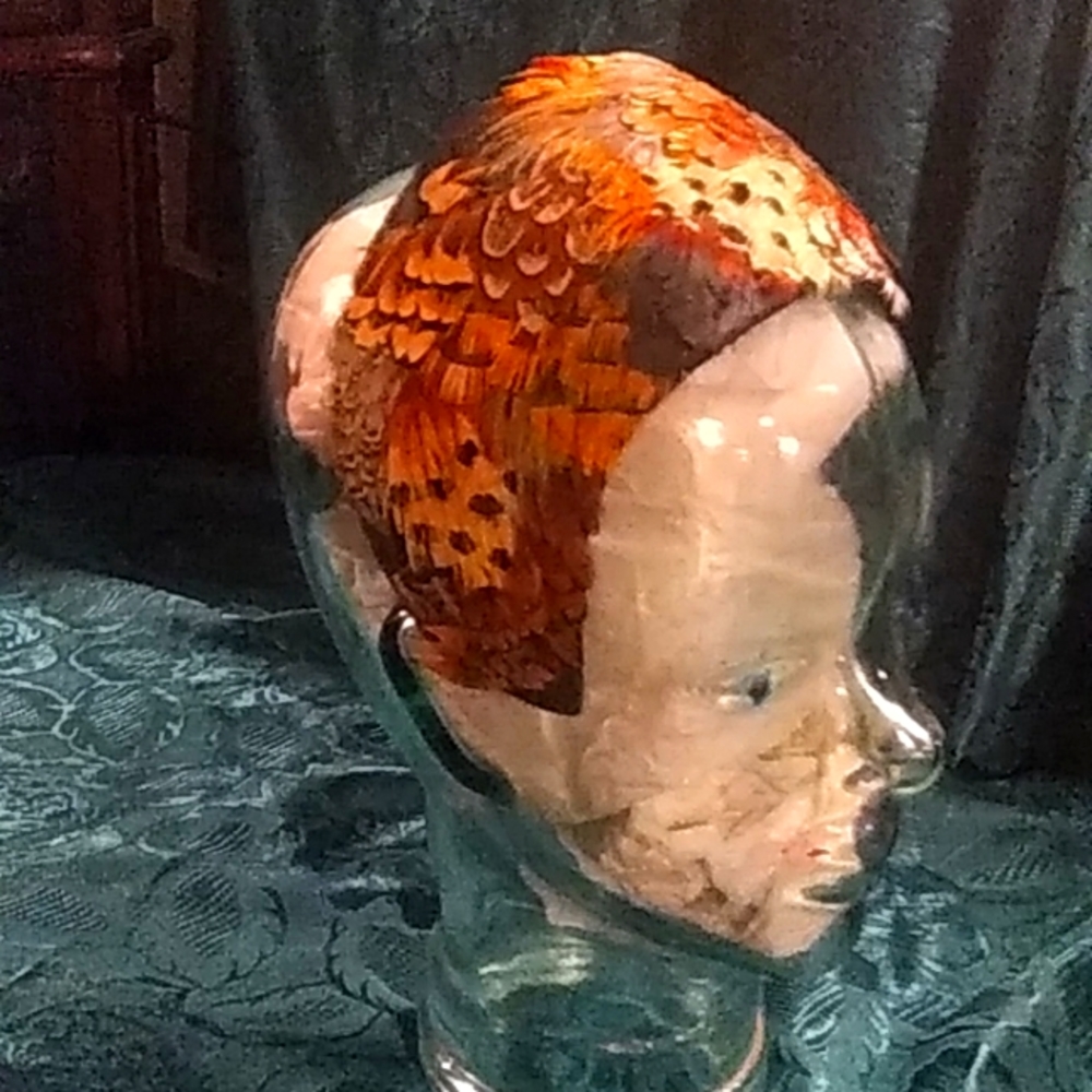 Vintage 1920s or 30's hat with golden pheasent feathers.